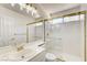Bright bathroom with a glass-enclosed shower and vanity at 902 Cripple Creek Ct, Henderson, NV 89014