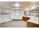 Bright bathroom featuring a soaking tub, shower, and dual sink vanity with a mirror at 902 Cripple Creek Ct, Henderson, NV 89014