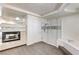 Bathroom featuring a glass shower, soaking tub and modern fireplace at 902 Cripple Creek Ct, Henderson, NV 89014