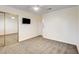 Carpeted bedroom featuring a mirrored closet and ceiling fan at 902 Cripple Creek Ct, Henderson, NV 89014