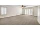 Large bedroom with ceiling fan and plantation shutters, bathed in bright natural light at 902 Cripple Creek Ct, Henderson, NV 89014
