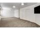 Large bonus room with plush carpet, ceiling fans, and a spacious layout at 902 Cripple Creek Ct, Henderson, NV 89014