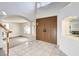 Bright foyer with tile flooring, high ceilings, an archway, and double doors at 902 Cripple Creek Ct, Henderson, NV 89014