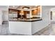 Gourmet kitchen with stainless steel appliances, granite countertops, and a breakfast bar, perfect for culinary enthusiasts at 902 Cripple Creek Ct, Henderson, NV 89014