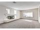 Cozy living room with a contemporary fireplace and ample natural light, perfect for creating a welcoming atmosphere at 902 Cripple Creek Ct, Henderson, NV 89014