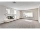 Bright and airy living room with carpet, modern fireplace and lots of natural light at 902 Cripple Creek Ct, Henderson, NV 89014