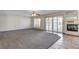 Spacious living room with new carpeting, fireplace, and access to a backyard pool area at 902 Cripple Creek Ct, Henderson, NV 89014
