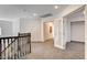 Upstairs landing featuring neutral carpet, recessed lighting, and decorative French doors at 902 Cripple Creek Ct, Henderson, NV 89014