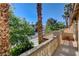 Patio with decorative railing and greenery, offering neighborhood views on a clear day at 902 Cripple Creek Ct, Henderson, NV 89014