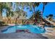 Backyard pool featuring stone accents and lush landscaping offering a serene and private retreat at 902 Cripple Creek Ct, Henderson, NV 89014