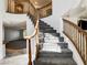 Elegant staircase with wooden railing leading to the upper level at 902 Cripple Creek Ct, Henderson, NV 89014