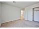 This bedroom features neutral carpeting, a closet, and a bright and open feel at 9122 Mountain Maple Ct, Las Vegas, NV 89148