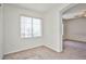 A bright, carpeted room with a large window at 9122 Mountain Maple Ct, Las Vegas, NV 89148