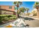 Entrance to the Maplewood community, showcasing lush landscaping, palm trees, and a welcoming stone sign at 9122 Mountain Maple Ct, Las Vegas, NV 89148
