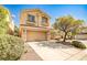 Traditional two-story home featuring a two-car garage, neutral stucco, and tidy front yard landscaping at 9122 Mountain Maple Ct, Las Vegas, NV 89148