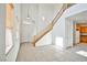 Bright foyer with tile floors, a staircase, and an open view to the kitchen creates an inviting entrance at 9122 Mountain Maple Ct, Las Vegas, NV 89148