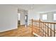 Hallway with wood floors and natural light, creating a warm and inviting transition space at 9122 Mountain Maple Ct, Las Vegas, NV 89148