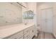 Second bathroom featuring a large vanity, mirrors, and linen closet at 9516 City Hill Ct, Las Vegas, NV 89134