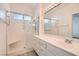 Bright bathroom with glass shower, vanity with drawers and sink at 9516 City Hill Ct, Las Vegas, NV 89134