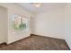 Bright bedroom with carpet flooring, a window with blinds, and a ceiling fan at 9516 City Hill Ct, Las Vegas, NV 89134