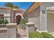 Close-up of the arched doorway and gated entrance to the home at 9516 City Hill Ct, Las Vegas, NV 89134