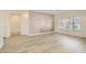 Bright and spacious living room featuring modern flooring and large window at 9516 City Hill Ct, Las Vegas, NV 89134