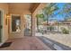 A covered patio with tile flooring and view of landscaped backyard at 9516 City Hill Ct, Las Vegas, NV 89134