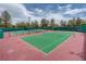 Community tennis court with nets and manicured landscaping at 9516 City Hill Ct, Las Vegas, NV 89134