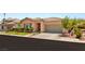 Charming single-story home featuring a tile roof, well-manicured lawn, and a two-car garage at 10463 Pioneer Park Ave, Las Vegas, NV 89135