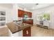 Kitchen featuring granite countertops, stainless steel sink, and bright natural lighting at 10463 Pioneer Park Ave, Las Vegas, NV 89135