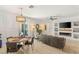 Open-concept living and dining area with modern finishes and ample natural light at 10463 Pioneer Park Ave, Las Vegas, NV 89135
