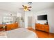 Spacious main bedroom boasts a ceiling fan, mirrored closet, and a modern dresser at 10463 Pioneer Park Ave, Las Vegas, NV 89135
