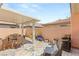 Charming outdoor patio with a covered seating area, perfect for dining al fresco at 10463 Pioneer Park Ave, Las Vegas, NV 89135
