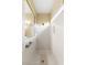 White shower stall with window and grab bars for accessibility and safety at 10463 Pioneer Park Ave, Las Vegas, NV 89135