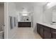Bright bathroom with tiled floor, dual vanities, and modern fixtures at 106 Rock Crossing Ave, North Las Vegas, NV 89031