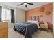Inviting bedroom featuring a cozy bed and decorative wall accents at 106 Rock Crossing Ave, North Las Vegas, NV 89031