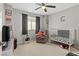 bedroom with a race car theme including a crib, chair, and fun decorations at 106 Rock Crossing Ave, North Las Vegas, NV 89031