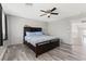 Bedroom features a dark wood bed frame, light blue bedding, and stairway access at 106 Rock Crossing Ave, North Las Vegas, NV 89031