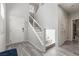 Light and bright entryway features gray walls, and stairs with chrome railings at 106 Rock Crossing Ave, North Las Vegas, NV 89031