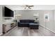 Upstairs living room with a comfortable blue sofa and large TV at 106 Rock Crossing Ave, North Las Vegas, NV 89031