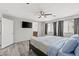 Spacious main bedroom with TV and ensuite bathroom access, with natural light at 106 Rock Crossing Ave, North Las Vegas, NV 89031