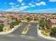 A gated entrance to a Primary-planned community with neatly landscaped features at 106 Rock Crossing Ave, North Las Vegas, NV 89031