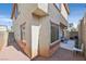 This home's backyard features privacy walls and a gravel ground cover at 10601 Lessona St, Las Vegas, NV 89141