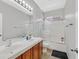 Bathroom featuring a shower, tub, double vanity and tile flooring at 10601 Lessona St, Las Vegas, NV 89141