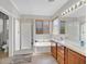 Bathroom featuring a shower, tub, double vanity and tile flooring at 10601 Lessona St, Las Vegas, NV 89141