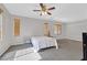 Bedroom with carpet, gray walls, and two windows with blinds for natural light at 10601 Lessona St, Las Vegas, NV 89141