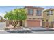 Charming two-story home with a well-maintained front yard and attached garage at 10601 Lessona St, Las Vegas, NV 89141
