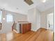 Upstairs hallway with hardwood floors, two light fixtures and a storage cabinet at 10601 Lessona St, Las Vegas, NV 89141
