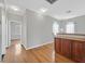 Upstairs hallway with hardwood floors, two light fixtures and a storage cabinet at 10601 Lessona St, Las Vegas, NV 89141