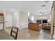 Open-concept living room showcasing seamless flow to the kitchen and dining area at 10601 Lessona St, Las Vegas, NV 89141